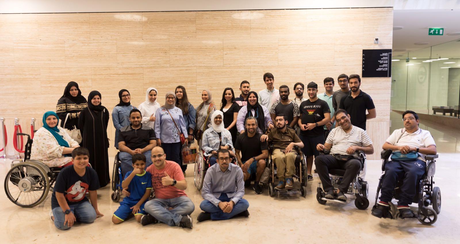 Group photo of TGI Members Club participants with and without disabilities.